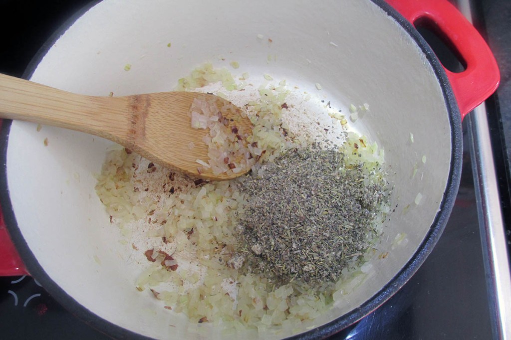 Add the garlic, basil and oregano to the pan